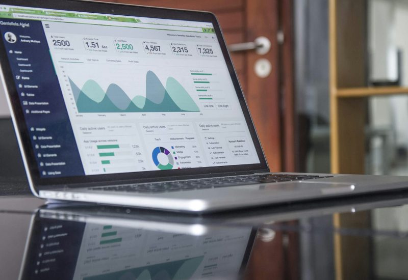 Laptop displaying charts and website analytics