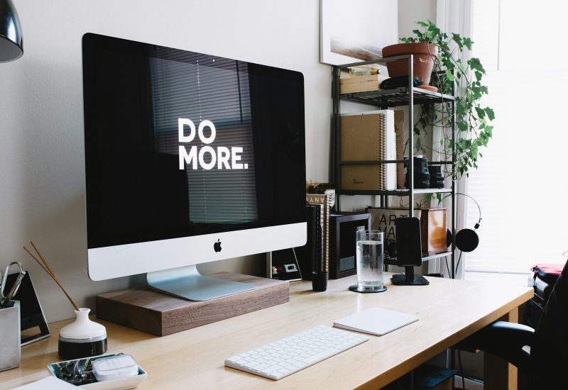 Desktop computer and stationery in a home workspace